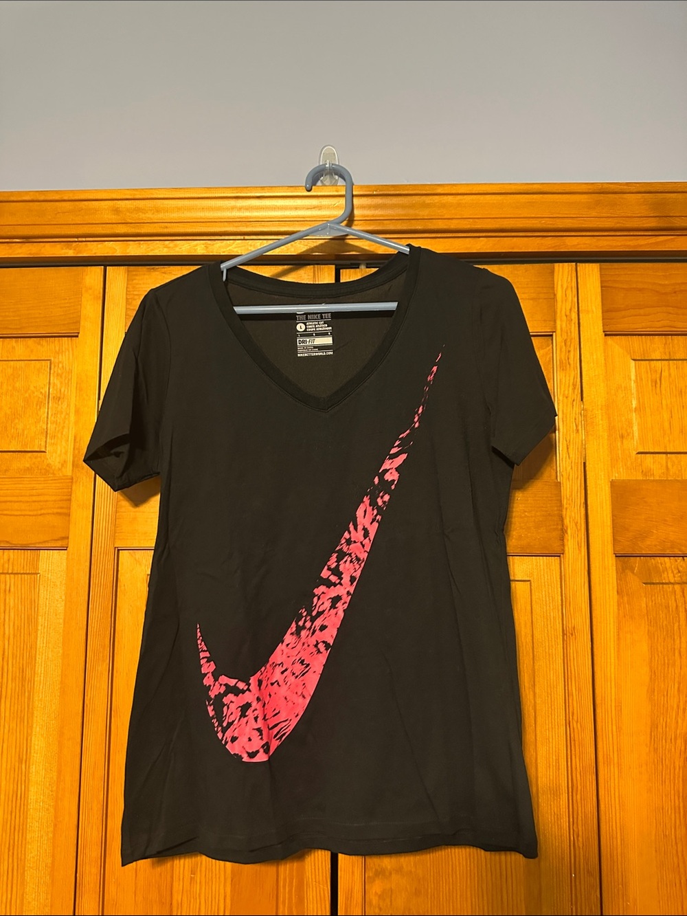 NWOT Nike Women's Black V-Neck Dri-Fit Tee with Large Pink Swoosh